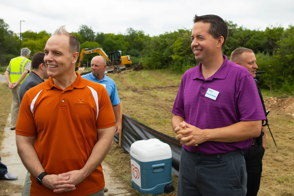 Winners holding check