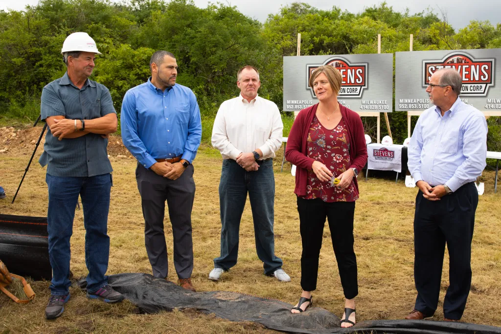 Winners holding check