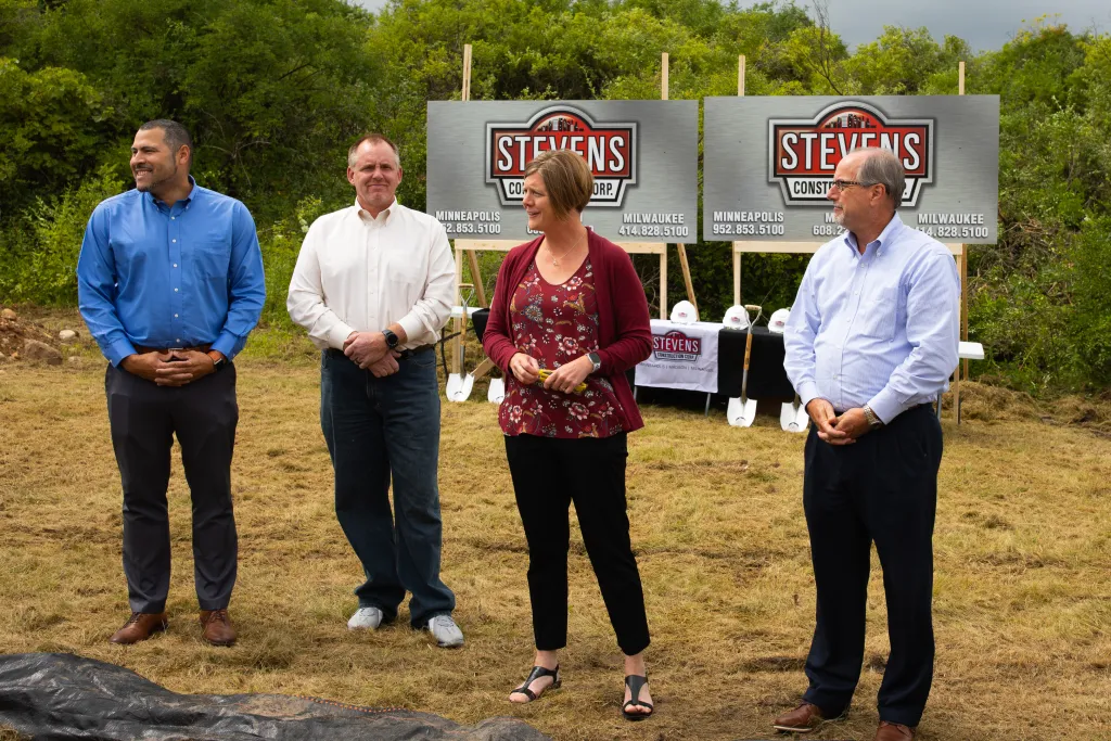 Winners holding check