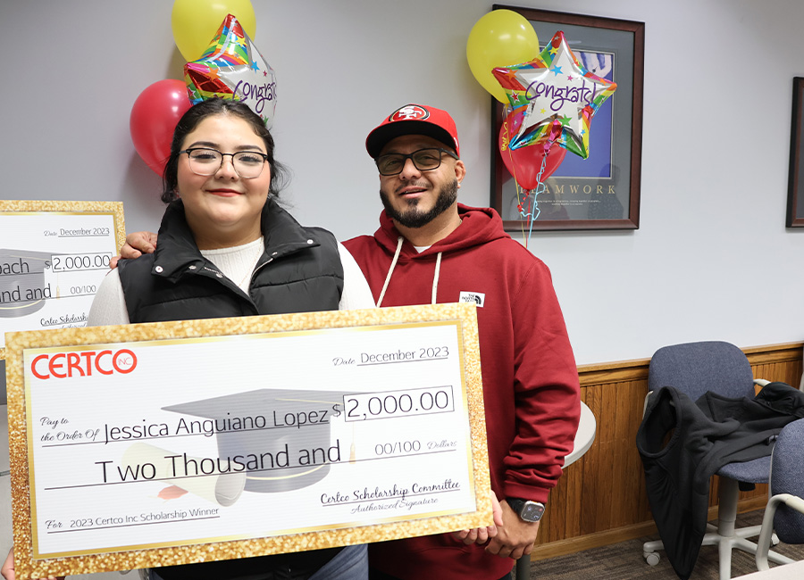 Winners holding check