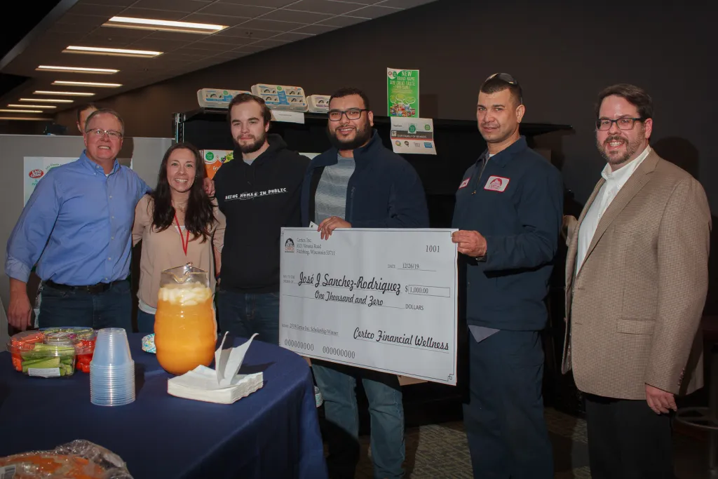 Winners holding check